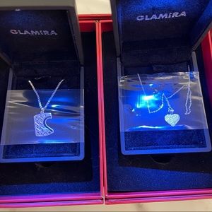 Two Glamira Necklaces with pendants.